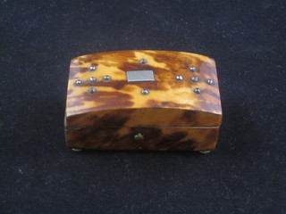 A rectangular tortoiseshell miniature trinket box with arched hinged lid, raised on 4 turned ivory supports 2 1/2"   ILLUSTRATED
