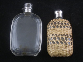 A Victorian glass hip flask with silver mount, London 1868  together with a glass and straw covered hip flask