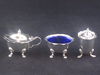 A 3 piece silver condiment set with inset blue liners, Birmingham 1934