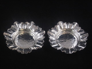 A pair of Victorian embossed circular silver dishes, Birmingham 1889, 2 ozs