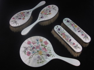 A handsome 5 piece silver and blue and floral enamelled dressing  table set comprising hand mirror, pair of hair brushes, pair of  clothes brushes, London 1956