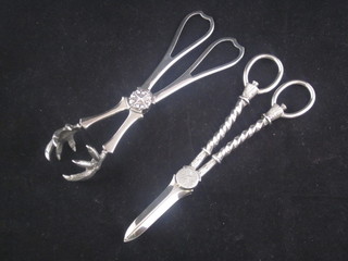 A pair of silver plated grape scissors and a pair of silver plated ice tongs