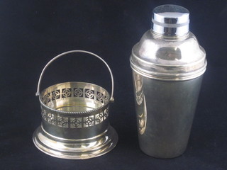 A silver plated cocktail shaker and a small circular dish with swing handle