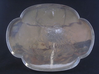 An oval engraved silver plated tray decorated a stork, raised on  bun feet 12"