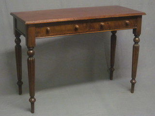 A Victorian mahogany side table fitted 2 drawers, raised on turned and reeded supports 42"