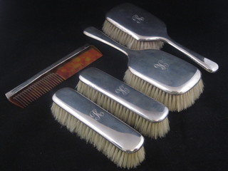 A 5 piece silver backed dressing table set comprising pair of hair brushes, pair of clothes brushes and a comb