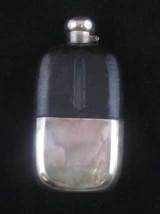 A glass and silver plated hip flask with detachable cup