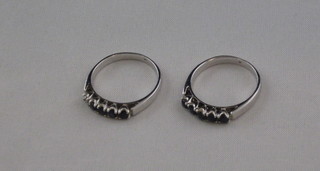A white metal dress ring set blue stones and 1 other set 5 blue stones, 1 missing