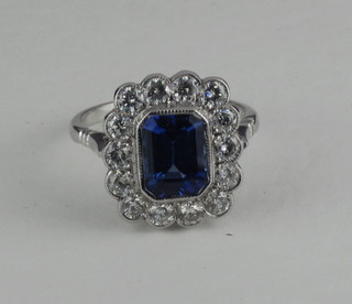 An 18ct white gold dress ring set a rectangular cut tanzanite  supported by diamonds, approx 1.20/2.30ct  ILLUSTRATED