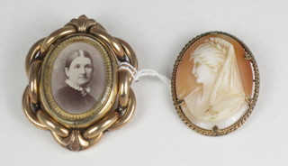 A pinchbeck double sided photo brooch together with a cameo  brooch