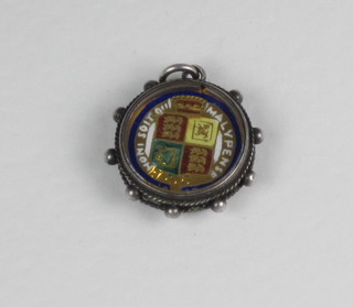A Victorian enamelled sixpence