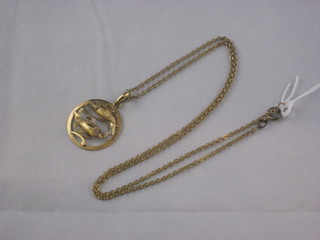 A 9ct gold Zodiac pendant hung on a fine chain