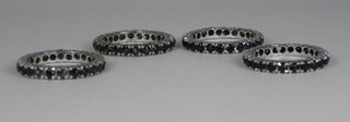 4 eternity rings set blue stones