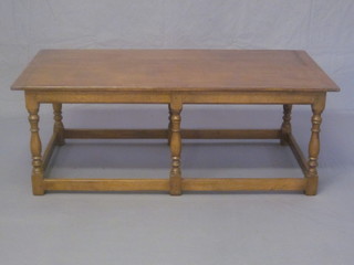 A rectangular Ipswich Oak coffee table, raised on 6 turned and  block supports 48"