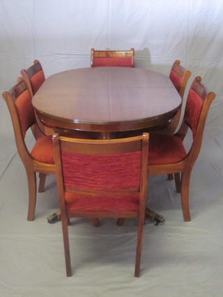 A Georgian style dining suite comprising D end extending dining  table with concealed extra leaf together with 6 dining chairs with  upholstered seats and backs, raised on sabre supports