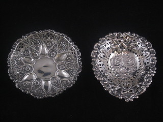 A small circular pierced silver dish and 1 other