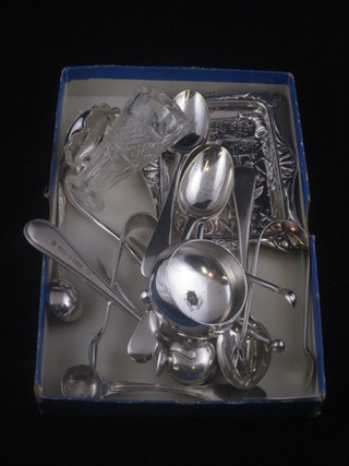 An embossed silver pin tray decorated Mr Punch, f, together  with a Georgian silver mustard spoon and a collection of plated  flatware