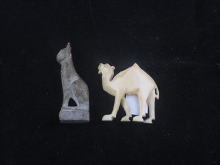 An Egyptian style carved model of a seated cat 2" and a carved  figure of a camel 1"