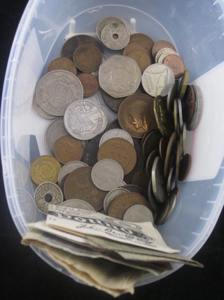 A collection of silver coins and bank notes
