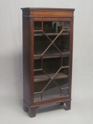 A 19th Century mahogany display cabinet with moulded and  dentil cornice, the interior fitted adjustable shelves enclosed by  astragal glazed panelled doors 21"