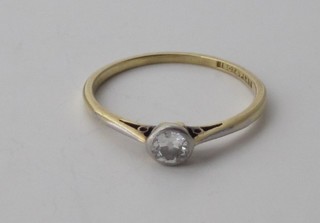 A lady's 18ct yellow gold dress ring set a solitaire diamond