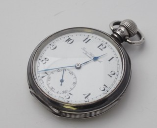 An open faced pocket watch with enamelled dial and Arabic numerals by J W Benson, contained in a silver case