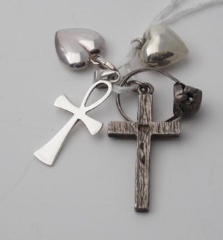 2 silver heart shaped lockets, 2 silver crosses and a silver ring