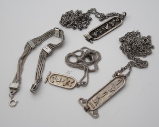 A silver bracelet and 3 silver Egyptian style pendants hung on  fine chains
