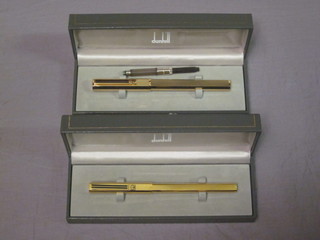 A Dunhill fountain pen contained in a gilt metal case together with a do. ballpoint pen