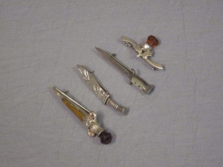 A brooch in the form of a bayonet, the blade marked Brugge, a  bar brooch in the form of a Kukri and 2 other bar brooches