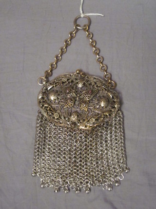 A small chain mail evening bag with pierced lid decorated a butterfly