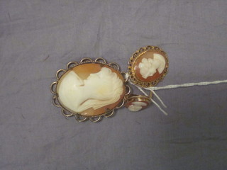 A stick pin set an opal, a shell carved cameo portrait brooch of a lady in a 9ct gold mount, do. pendant and a ring