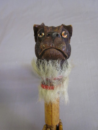 A parasol, the carved wood handle in the form of a dogs head  with hardstone eyes