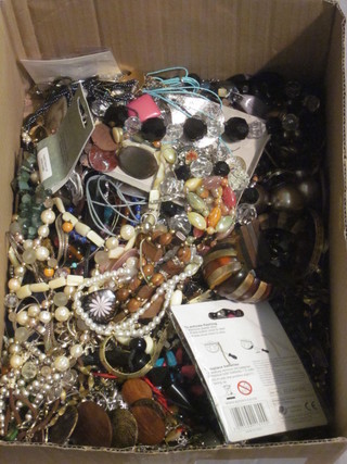 A box containing a collection of costume jewellery