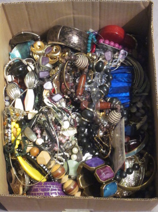 A box containing a collection of costume jewellery