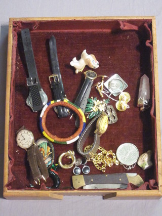 A box containing a collection of costume jewellery, wristwatches etc