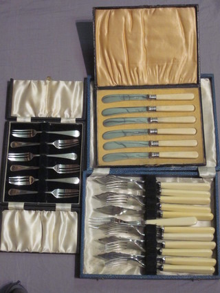 A set of 6 silver plated fish knives and forks, 6 silver plated tea knives, 6 silver plated pastry forks, cased