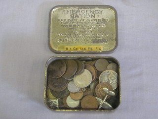 An Emergency Ration tin containing a collection of various coins