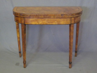 A Georgian D shaped mahogany card table with crossbanded top  inlaid satinwood stringing, raised on square tapering supports 36"   ILLUSTRATED