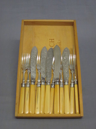 A set of 6 silver plated fish knives and forks by Mappin & Webb,  the blades decorated fish