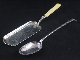 A large silver plated serving spoon and a crumb scoop