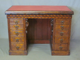 A Victorian childs pine pedestal kneehole desk with inset writing surface above 10 short drawers 37"