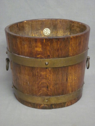 A 1930's circular oak coopered planter by R A Lister 10"