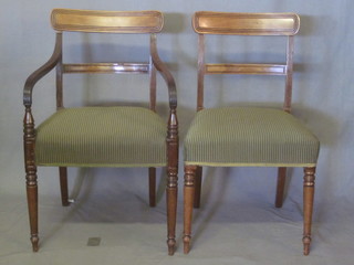 A set of 8 Georgian mahogany bar back dining chairs - 2 carvers,  6 standard with shaped mid rails and upholstered seats, raised on  turned and reeded supports  ILLUSTRATED