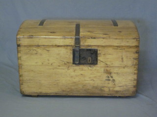 A domed Continental stripped and polished pine coffer with  hinged lid and iron drop handles 30"