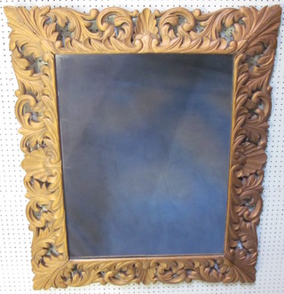 A rectangular plate wall mirror contained in a gilt painted carved frame 41"