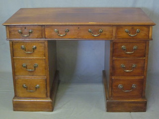 A Victorian walnut kneehole pedestal desk fitted 1 long drawer and 6 short drawers with brass swan neck drop handles 45"