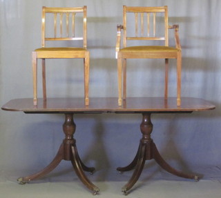 A Georgian style dining suite comprising D end extending dining  table raised on pillar and tripod supports with 1 extra leaf and 6  stick and bar back dining chairs - 2 carvers, 4 standard