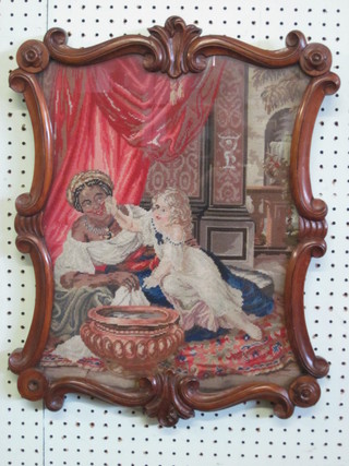 A Victorian mahogany pole screen banner of serpentine outline,  set a Berlin wool work of a seated lady and child, 16"