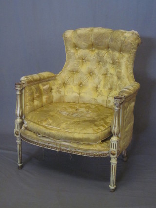 A French style salon armchair upholstered in yellow buttoned material